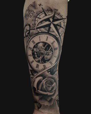 rose clock realistic tattoo by gargoyle tattoo studio